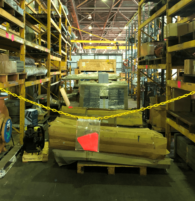 large warehouse with shelves of stock and materials